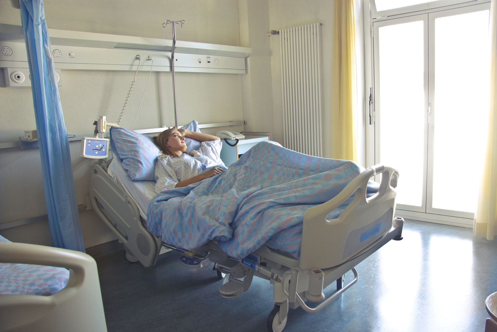 Canva Photo of Woman Lying in Hospital Bed 1
